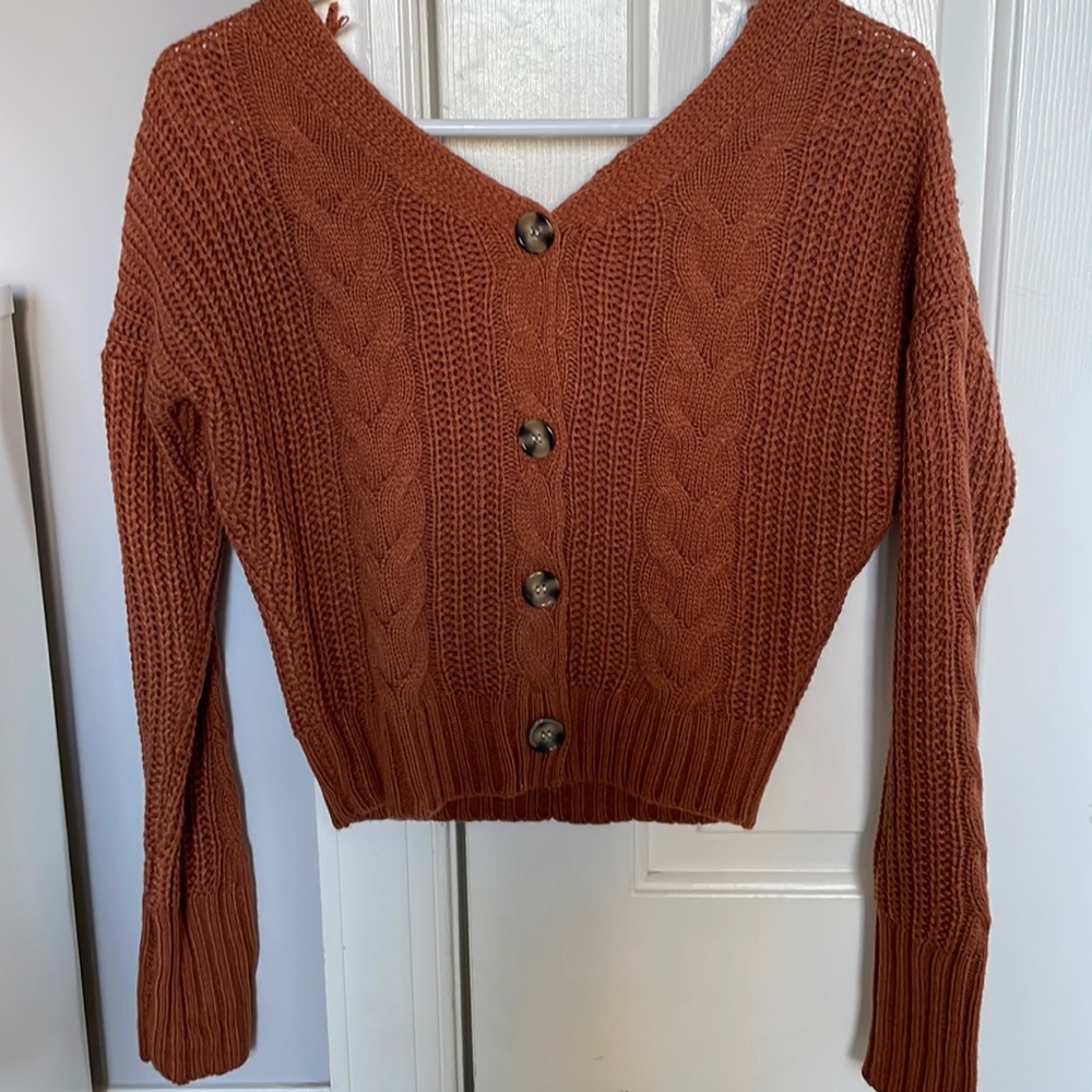 Orange sweater with buttons